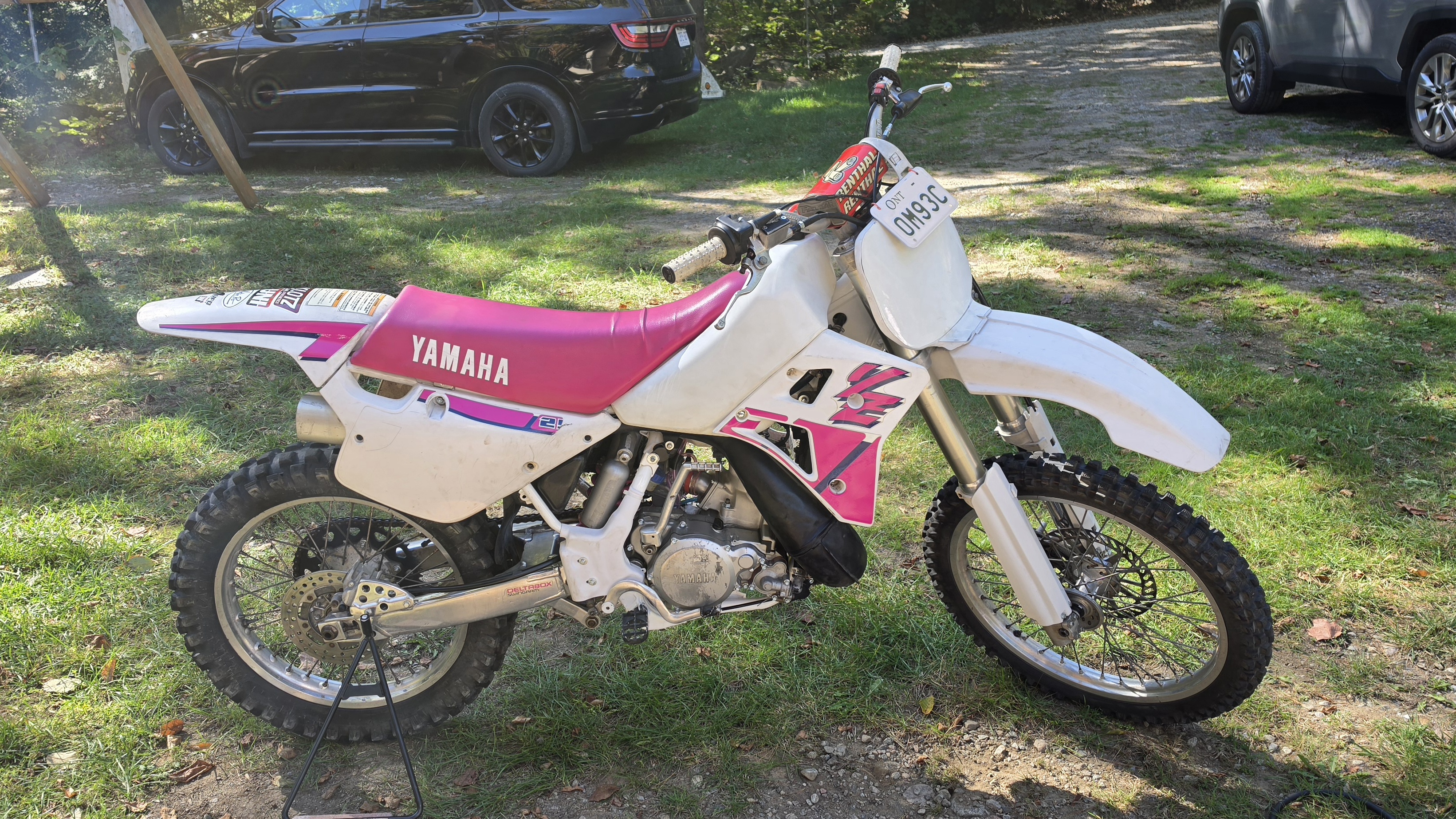 White Yamaha dirt bike parked outdoors
